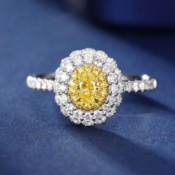 An oval yellow diamond set in a bezel setting Lab-grown Diamond Ring