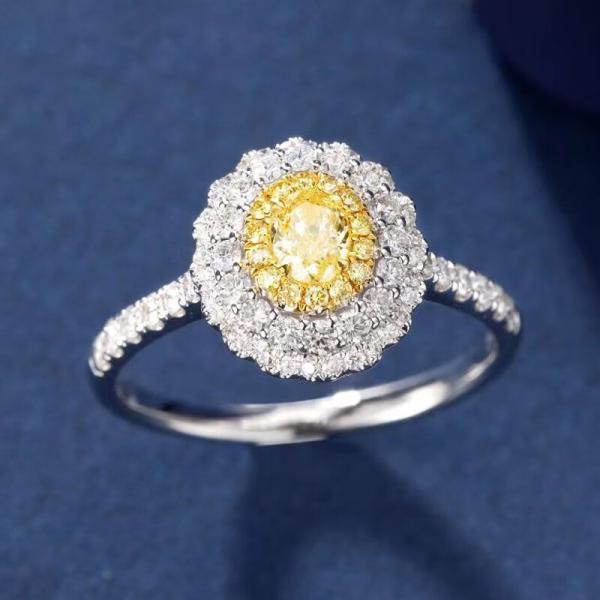 An oval yellow diamond set in a bezel setting Lab-grown Diamond Ring